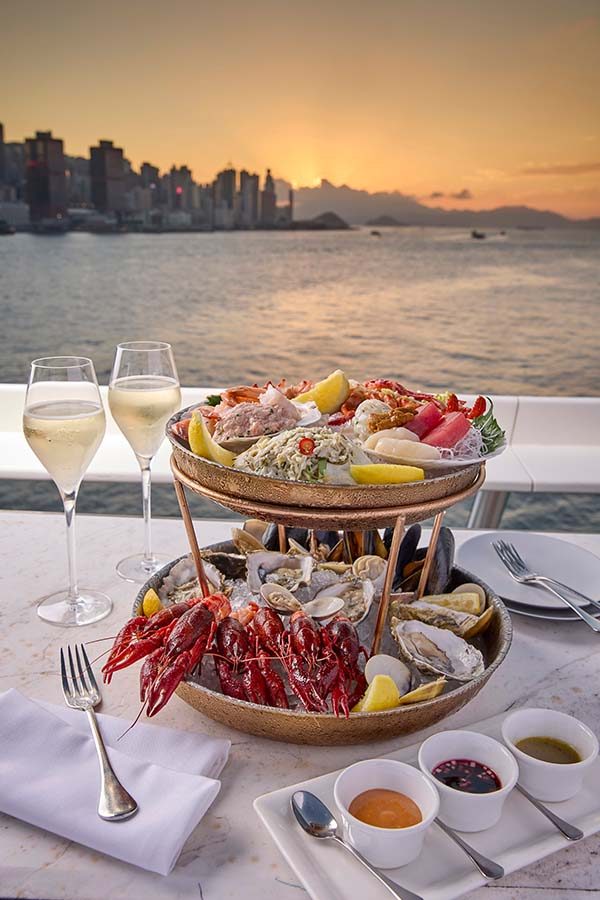 Deluxe seafood platter for two with Victoria Harbour as backdrop at Harbourside Grill